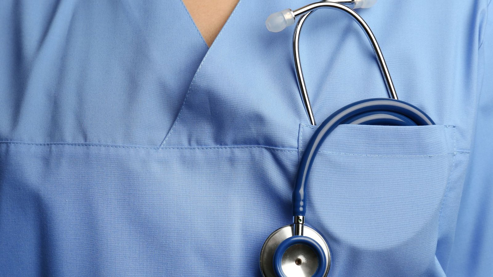 Cover Image showing the front of scrub top with stethoscope in the pocket